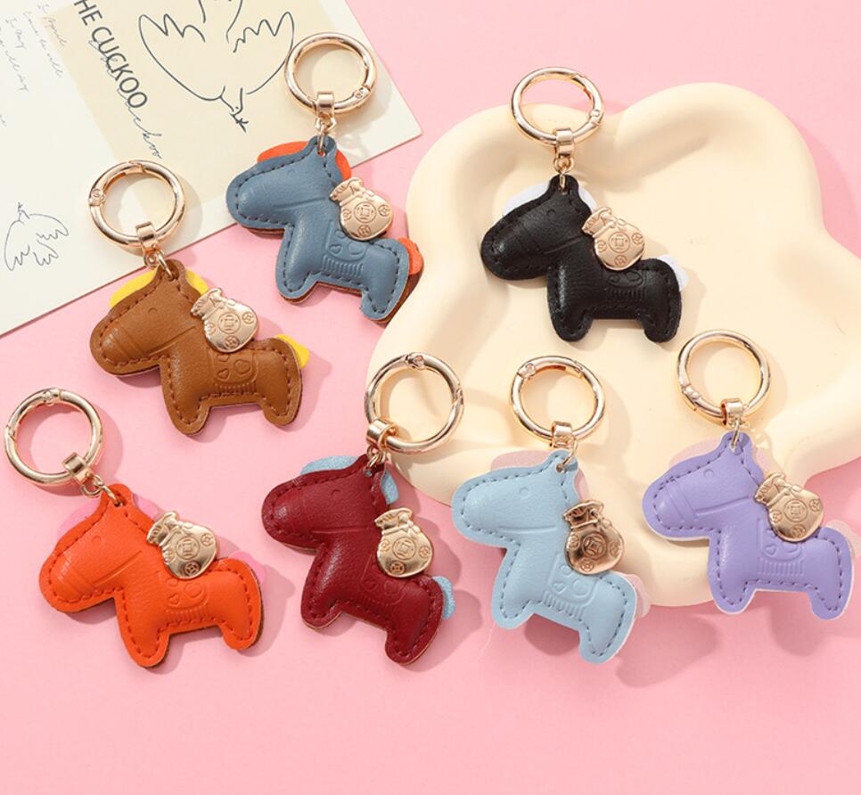 Horses and money bag keychain