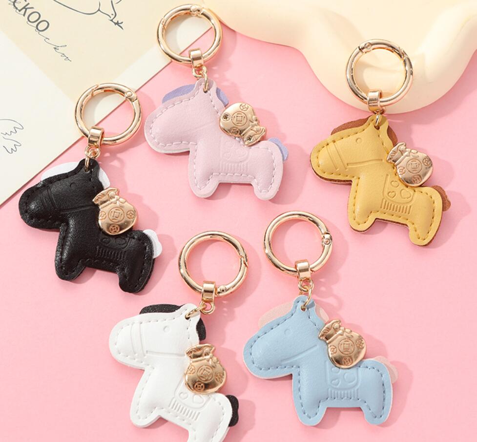 Horses and money bag keychain