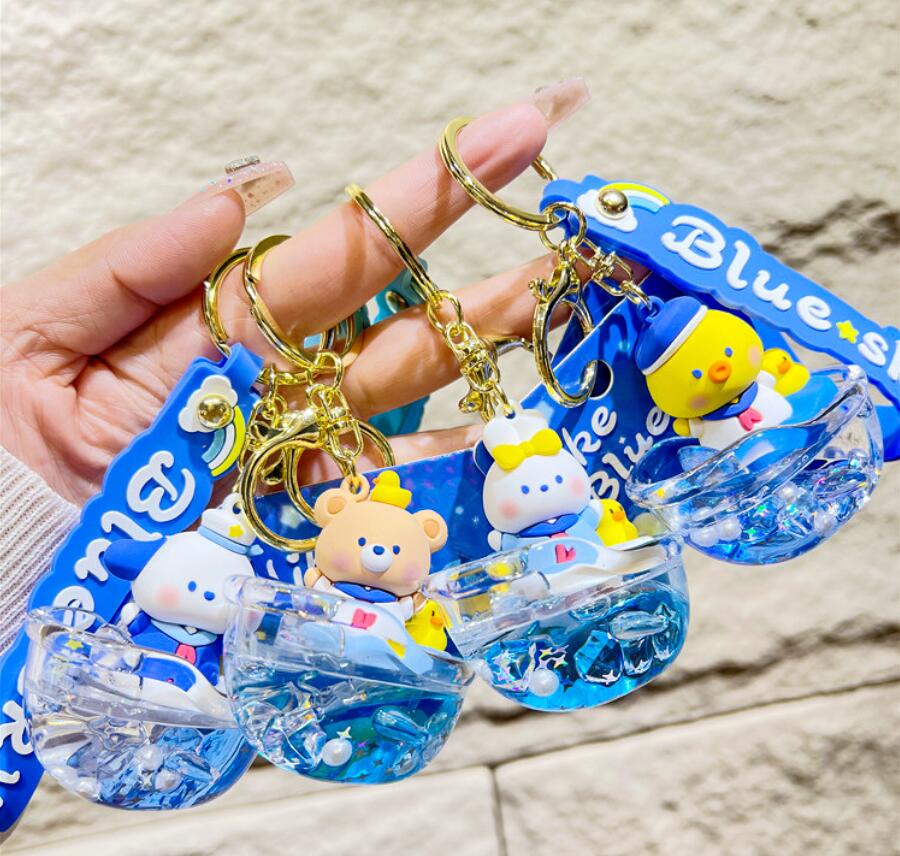 Flowing liquid boat and cartoon bear keychain
