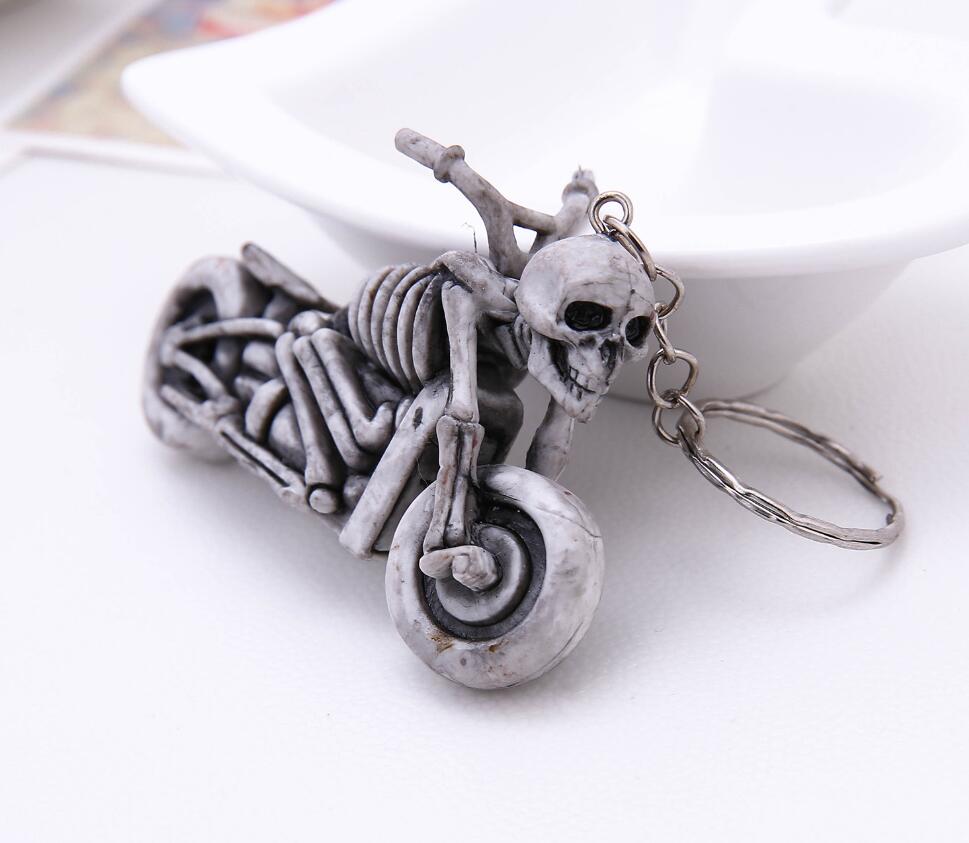 Skeleton man riding a motorcycle keychain